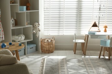 Stylish playroom with decor and furniture. Interior design