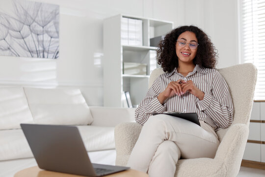 Professional psychologist working with laptop in office