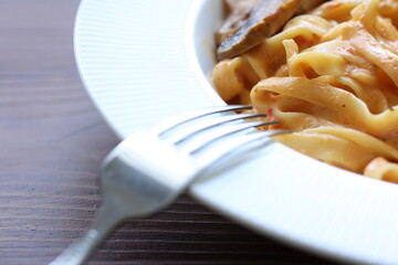 Creamy mushroom and chicken Mediterranean Italian Tagliatelle Pasta close up