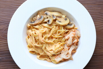 Creamy mushroom and chicken Mediterranean Italian Tagliatelle Pasta close up