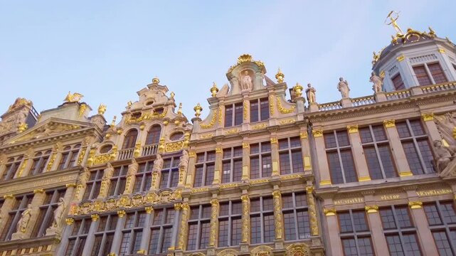 The ornate guildhalls of grand place stand tall in brussels, belgium