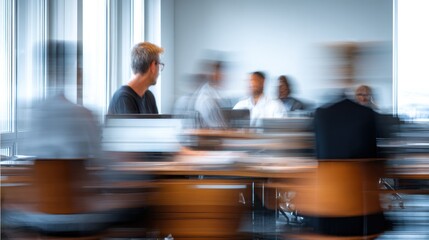 Blurred image of people working in an office