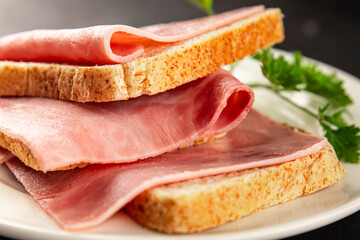 Sandwich ham slices meat spam pork fresh gourmet food background on the table rustic food top view...