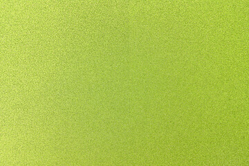 Texture of colored paper. Decorative sheet of cardboard. Green shiny background.	