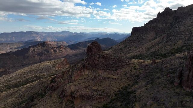Aerial view of mountains and valley under clouds, United States.