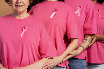 Women wearing pink ribbons supporting breast cancer awareness