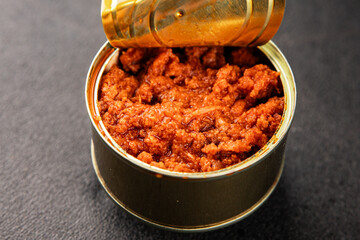 Tuna tomato sauce canned fish seafood fresh delicious gourmet food background on the table rustic food top view copy space keto and paleo diet vegan food pescetarian diet