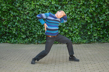 Dancer performing modern dance choreography in urban environment