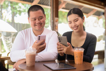 Happy young couple sitting in coffee shop