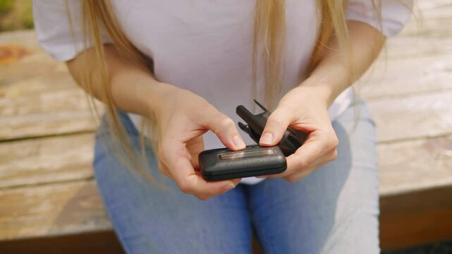 Pager beeper device close up on a desk, retro phone 90s instant communication and connection, sms messaging in the early 80s 90s digital age
