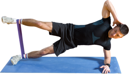 Athletic guy in sportswear and fitness tracker doing exercises in gym.