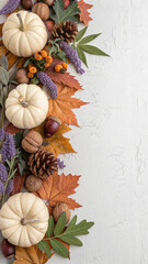 Colorful pumpkins, acorns, dry leaves, walnuts, pine cones, and lavender flowers are creating a beautiful autumnal frame on a textured surface, perfect for thanksgiving or halloween projects
