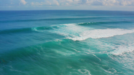 Ocean waves rolling towards the shore, creating a mesmerizing display of nature's power and beauty.