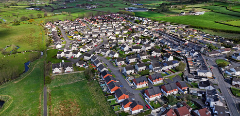 Aerial drone view of Residential housing homes Ballyclare Town in Antrim Northern Ireland UK