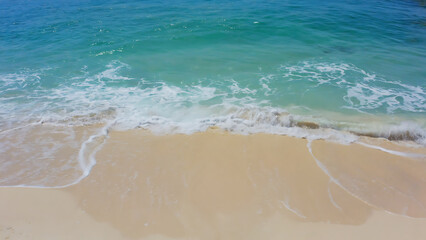 A beautiful beach with turquoise water and golden sand, perfect for a relaxing vacation getaway.