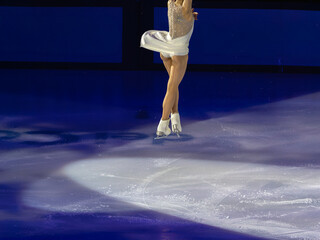 Skater performing a Jump  and Artistic and Technical performance on the Ice Rink