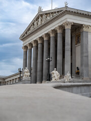 Facade of Neoclassical Parliament Building in Vienna with its Iconic Columns and Statues, Austria