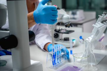 Unknown medical scientist working with tube test in laboratory