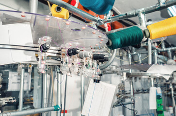 Tensioners of colored threads located on spools on machines. Industrial enterprise for the...