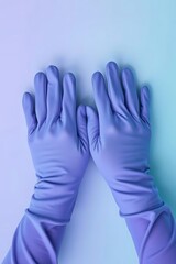 Obraz premium Hands adorned in protective violet gloves on gradient serene backdrop
