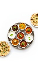 Indian food thali assortment of curries and naan bread on a white background delicious and tasty cuisine