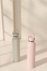 Minimalist reusable water bottles in pastel colors under natural sunlight. 3d rendering