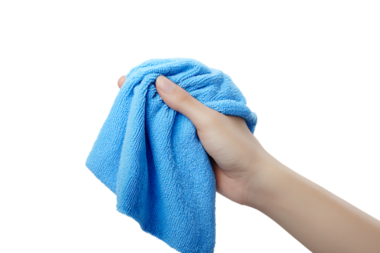 Close up of a hand holding a crumpled blue microfiber cloth.
