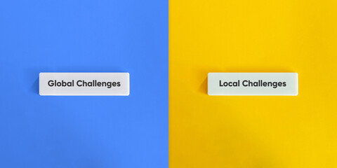 Global Versus Local Challenges Concept on Letter Tiles with Yellow and Blue Background