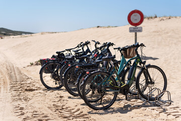 Bicycle parking on a sandy beach in Les Landes