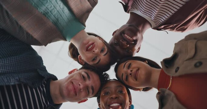 Face, teamwork and community with business people in office for mission, synergy or trust. Partnership, collaboration and inclusion with low angle of employees in agency for support and diversity