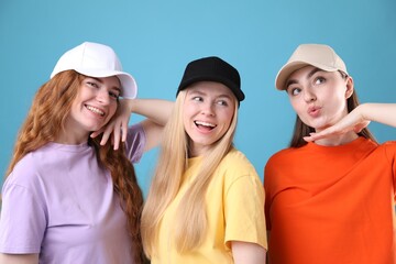 Beautiful women with different hair colors on light blue background