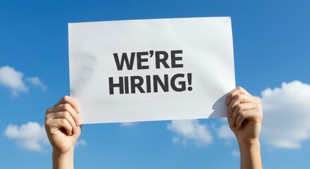Job Opportunity Were Hiring sign against blue sky Open position.