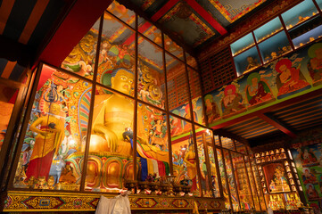 Obraz premium Darjeeling ,West Bengal, India - 20.08.2023 : Beautiful view of interior of Ghum Monastery. Image taken with permission. Peaceful, calm and religious respected environment inside Buddist Monastery.