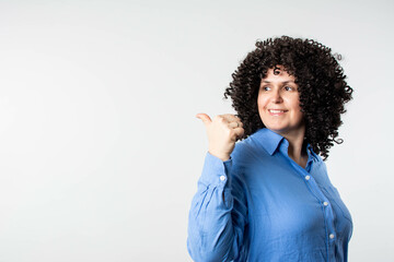 Smiling beautiful woman looking at empty copy space for advertising or brand message, isolated on...