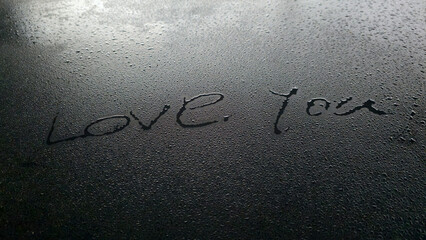 On a black background, the words 