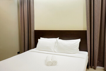 white bed with pillows