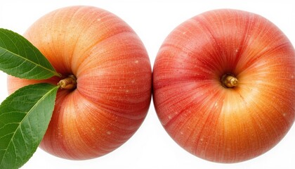 Close up shot of two donut peaches with leaves on a white background in a studio setting