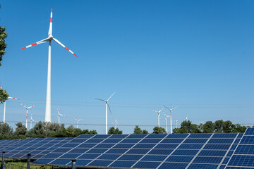 Green energy generation with wind turbines and solar panels seen in Germany