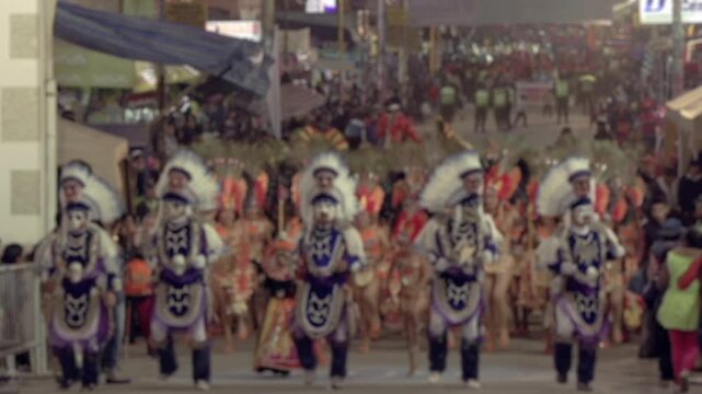 Blurred Feathered and Masked Dancers Marching and Dancing During Virgin of Urkupina Celebration, Quillacollo, Bolivia - Slow Motion 