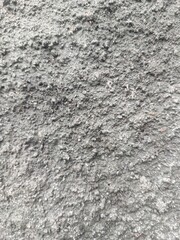 Natural stone wall with rugged stacked brown and grey rocks, perfect for construction background, rustic themes, and architectural surfaces
