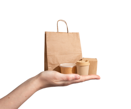 Takeout food delivery concept. Hand holding eco friendly packaging with kraft paper bag, cardboard