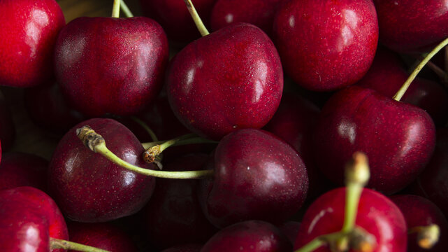 Juicy cherries with cuttings macro photography