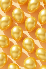 Golden balloons floating on a soft orange background.