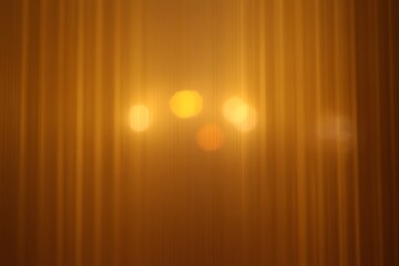 Golden Stage Curtains with Soft Bokeh Lights Creating a Warm and Inviting Atmosphere