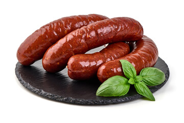Smoked Sausages on Black Slate Plate, isolated on white background