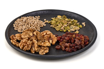 Seeds Walnuts Raisins, Plate, isolated on white background