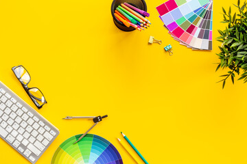 Decorator workspace flat lay. Creative designers table with color paint swatches