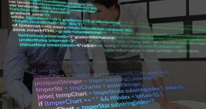 Code overlay scrolling driving tech team leaning over laptop tracing code and jotting review notes