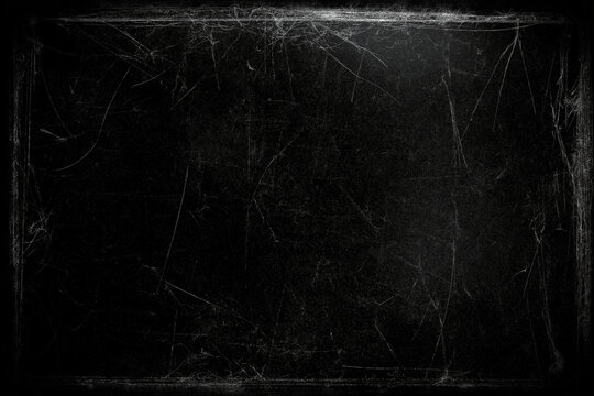 A very dark solid black background with scratches to go behind movie credits for a horror movie. mostly solid black