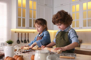 Cooking recipe. Little boy making cookies at table in kitchen